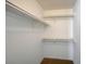 A walk-in closet with white shelving, with a brown carpeted floor at 231 W Horizon Ridge Pkwy # 426, Henderson, NV 89012