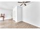 A spacious bedroom with hardwood floors, a ceiling fan, and a minimalist aesthetic at 231 W Horizon Ridge Pkwy # 812, Henderson, NV 89012