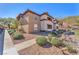 A charming condo with an earth-toned exterior, complemented by well-maintained landscaping and a clear blue sky at 231 W Horizon Ridge Pkwy # 812, Henderson, NV 89012