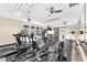 Community gym with modern equipment, mirrors, and plenty of natural light at 231 W Horizon Ridge Pkwy # 812, Henderson, NV 89012
