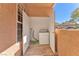 Exterior laundry room featuring full-size washer and dryer at 231 W Horizon Ridge Pkwy # 812, Henderson, NV 89012