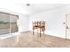 A well-lit living room featuring hardwood floors, with access to an outdoor space via sliding glass doors at 231 W Horizon Ridge Pkwy # 812, Henderson, NV 89012
