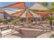 Community patio featuring shade structure, lounge chairs, and well maintained landscaping at 231 W Horizon Ridge Pkwy # 812, Henderson, NV 89012