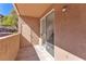 Private outdoor patio offering a secluded retreat with sliding glass doors and a stucco wall at 231 W Horizon Ridge Pkwy # 812, Henderson, NV 89012