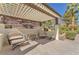 Comfortable lounge seating on an outdoor patio with a pergola and desert landscaping at 231 W Horizon Ridge Pkwy # 812, Henderson, NV 89012