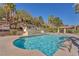 Community pool and lounge area with lush landscaping and covered seating at 231 W Horizon Ridge Pkwy # 812, Henderson, NV 89012