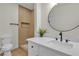 Updated bathroom featuring new vanity, fixtures and a modern walk in shower at 2837 Reynolds Ave, North Las Vegas, NV 89030