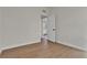 Minimal bedroom with new floors featuring a view into the bright kitchen at 2837 Reynolds Ave, North Las Vegas, NV 89030