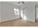 Simple bedroom with new floors featuring sliding closet doors and a window at 2837 Reynolds Ave, North Las Vegas, NV 89030