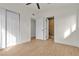 Clean, bright bedroom featuring modern closet doors and wood look floors at 2837 Reynolds Ave, North Las Vegas, NV 89030