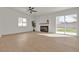 Spacious living room with fireplace, new floors, and bright sliding glass doors at 2837 Reynolds Ave, North Las Vegas, NV 89030