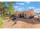 Expansive backyard showcasing a covered patio, mature landscaping, and open space at 3040 Ocean Port Dr, Las Vegas, NV 89117