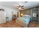 Spacious bedroom with ceiling fan, and tile flooring, offering comfort and style at 3040 Ocean Port Dr, Las Vegas, NV 89117