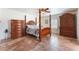 Bedroom features four poster bed, light-colored walls, shuttered windows, and a ceiling fan at 3040 Ocean Port Dr, Las Vegas, NV 89117