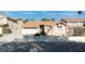 Charming single-story home with a well-manicured front yard and attached two-car garage at 3040 Ocean Port Dr, Las Vegas, NV 89117