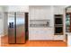 Bright kitchen featuring stainless steel refrigerator, double ovens, and ample counter space at 3040 Ocean Port Dr, Las Vegas, NV 89117