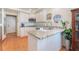 Bright kitchen with stainless steel appliances, granite countertop and unique tile backsplash at 3040 Ocean Port Dr, Las Vegas, NV 89117