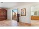Spacious living room featuring sliding door access to the outdoor patio and light-filled bathroom access at 3040 Ocean Port Dr, Las Vegas, NV 89117