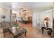 Spacious living room featuring neutral paint, large windows with shutters, and easy access to the dining area at 3040 Ocean Port Dr, Las Vegas, NV 89117