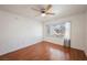 Well-lit bedroom featuring hardwood floors, ceiling fan, and a window providing ample natural light at 3087 Key Largo Dr # 202, Las Vegas, NV 89120