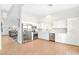 Spacious kitchen featuring stainless steel appliances, white cabinetry, and light wood flooring at 35 Spur Cross Cir, Henderson, NV 89012