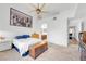 Bedroom with ceiling fan, bed, and connecting door at 3924 Quiet Pine St # 201, Las Vegas, NV 89108