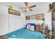 Bedroom view with white closet doors, carpet, and overhead fan at 3924 Quiet Pine St # 201, Las Vegas, NV 89108