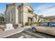 Apartment building exterior with balconies, stairs, and car parking at 3924 Quiet Pine St # 201, Las Vegas, NV 89108