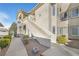 Apartment building exterior with stairs, patios, desert landscaping, and sidewalks at 3924 Quiet Pine St # 201, Las Vegas, NV 89108