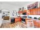 Well-lit kitchen boasts stainless steel appliances, wood cabinets, and an open design flowing into the living area at 3924 Quiet Pine St # 201, Las Vegas, NV 89108