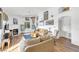 Bright living room featuring hardwood floors, fireplace, and ample natural light at 3924 Quiet Pine St # 201, Las Vegas, NV 89108