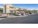 Apartment complex parking lot with covered spaces and multiple parked cars at 3924 Quiet Pine St # 201, Las Vegas, NV 89108