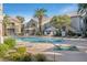 Community pool and spa area with lounge chairs and well-maintained landscaping at 3924 Quiet Pine St # 201, Las Vegas, NV 89108