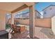 View of the backyard featuring patio, turf, and surrounding houses at 457 Cornelius Kelly Ave, Henderson, NV 89011