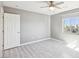 Bedroom with grey walls, a ceiling fan and a bright window at 457 Cornelius Kelly Ave, Henderson, NV 89011