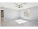 Bedroom with a ceiling fan, window, and hardwood floors at 457 Cornelius Kelly Ave, Henderson, NV 89011