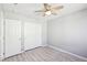 Bright bedroom featuring a ceiling fan, closet and a door at 457 Cornelius Kelly Ave, Henderson, NV 89011