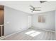 Grey bedroom includes a ceiling fan and bright window at 457 Cornelius Kelly Ave, Henderson, NV 89011