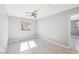 Light filled bedroom with ceiling fan and white woodgrain flooring at 457 Cornelius Kelly Ave, Henderson, NV 89011