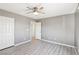 Bright bedroom featuring hardwood flooring and a ceiling fan at 457 Cornelius Kelly Ave, Henderson, NV 89011