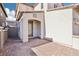 Inviting front entrance with brick paved patio, leading to a modern-style front door and charming exterior design at 457 Cornelius Kelly Ave, Henderson, NV 89011