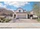 Charming two-story home featuring a desert-landscaped yard, brick driveway, and attached two-car garage at 457 Cornelius Kelly Ave, Henderson, NV 89011