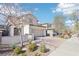 Charming two-story home featuring a desert-landscaped yard, brick driveway, and attached two-car garage at 457 Cornelius Kelly Ave, Henderson, NV 89011