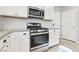 The stainless steel stove and microwave complement the clean design in this lovely kitchen at 457 Cornelius Kelly Ave, Henderson, NV 89011