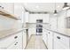 Bright kitchen with white cabinets and stainless steel appliances at 457 Cornelius Kelly Ave, Henderson, NV 89011