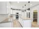 Beautiful kitchen features a large island, granite countertops, and stainless steel appliances at 457 Cornelius Kelly Ave, Henderson, NV 89011
