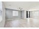 Spacious living room with modern ceiling fan, recessed lighting, and large windows providing ample natural light at 457 Cornelius Kelly Ave, Henderson, NV 89011