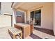 Covered patio area with brick pavers and a wooden dining set at 457 Cornelius Kelly Ave, Henderson, NV 89011