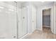 This bathroom features a glass-enclosed shower with a built-in bench and chrome fixtures at 457 Cornelius Kelly Ave, Henderson, NV 89011