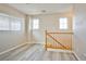 Hallway features wood railing, wood-style flooring and natural light at 4817 Eureka Diamond Ct, Las Vegas, NV 89139